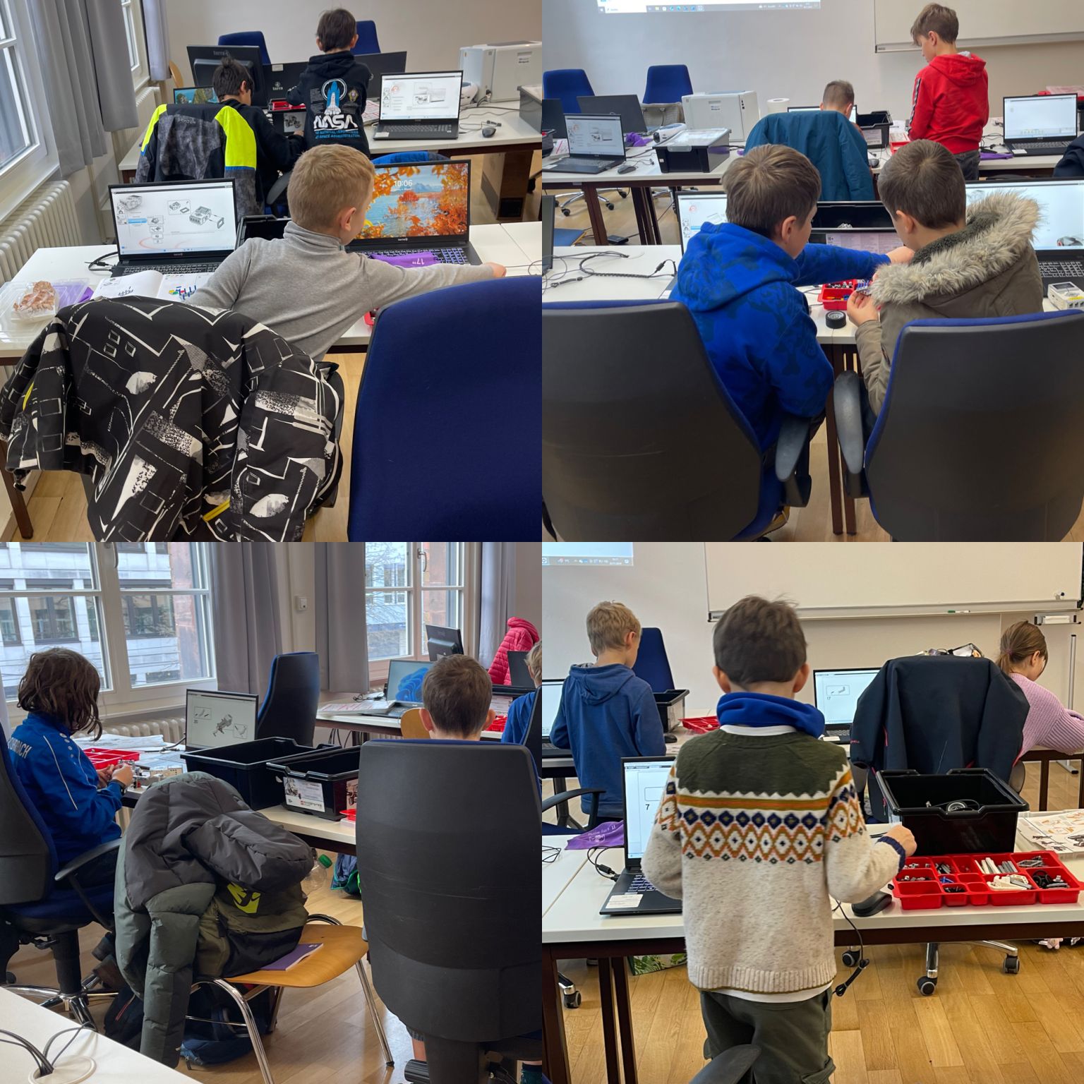 Zwei Kinder, die konzentriert einen Roboter aus LEGO Steinen bauen.